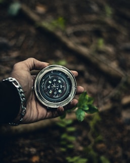 person holding compass