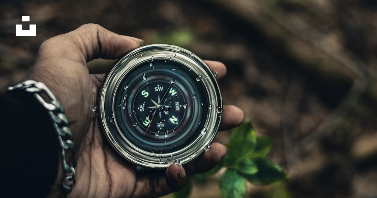 Person holding compass photo – Free Compass Image on Unsplash