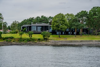 A beautiful modern luxury home with large windows and landscaped garden in Vancouver.