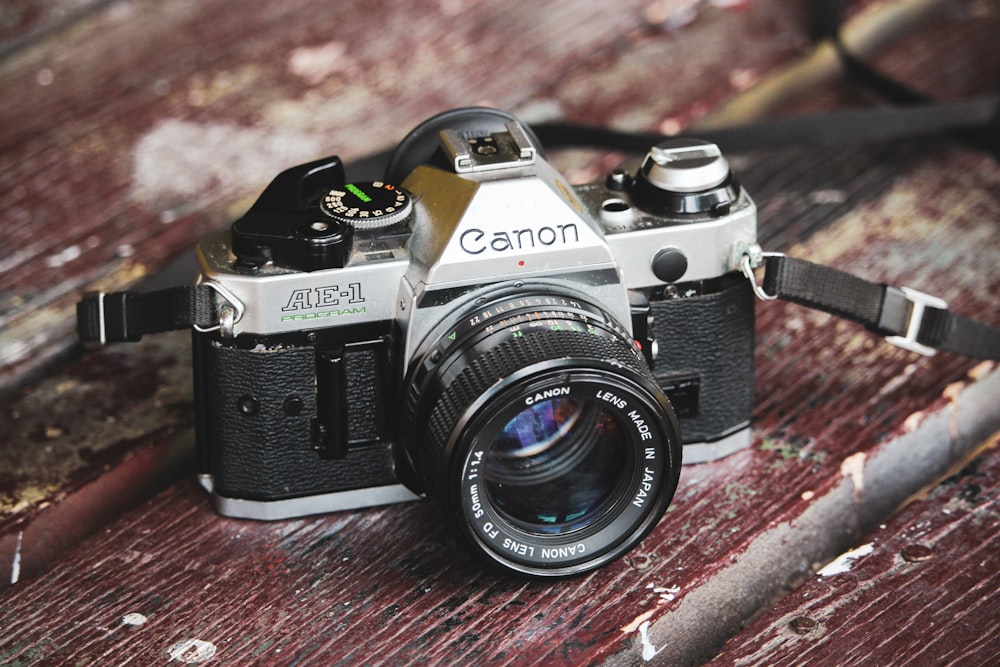 black and gray Canon AE-1 DSLR camera