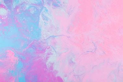 a pink and blue background with a lot of bubbles