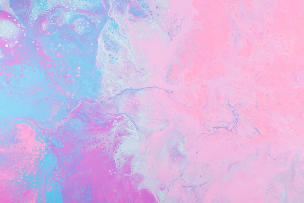 a pink and blue background with a lot of bubbles