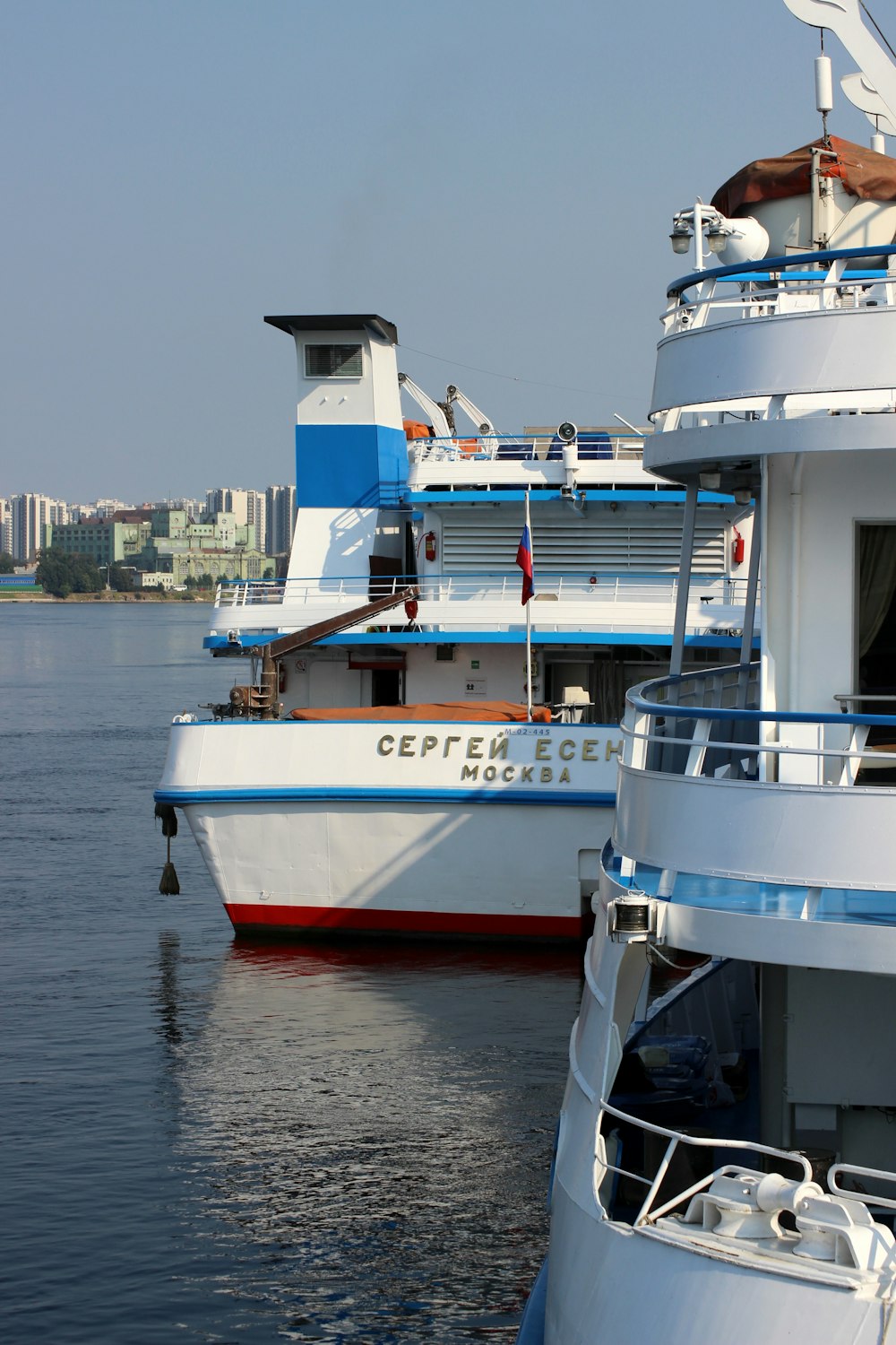 white and blue boat