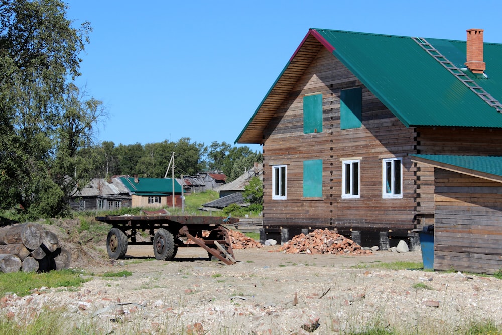 carriage in front of wooden house