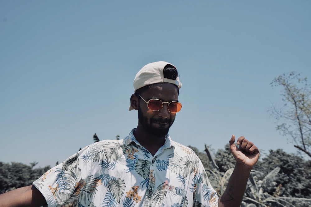 man wearing floral dres s shirt