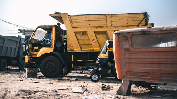 Image of a Sameena Global truck parked at a Sharjah industrial site during scrap pick-up.