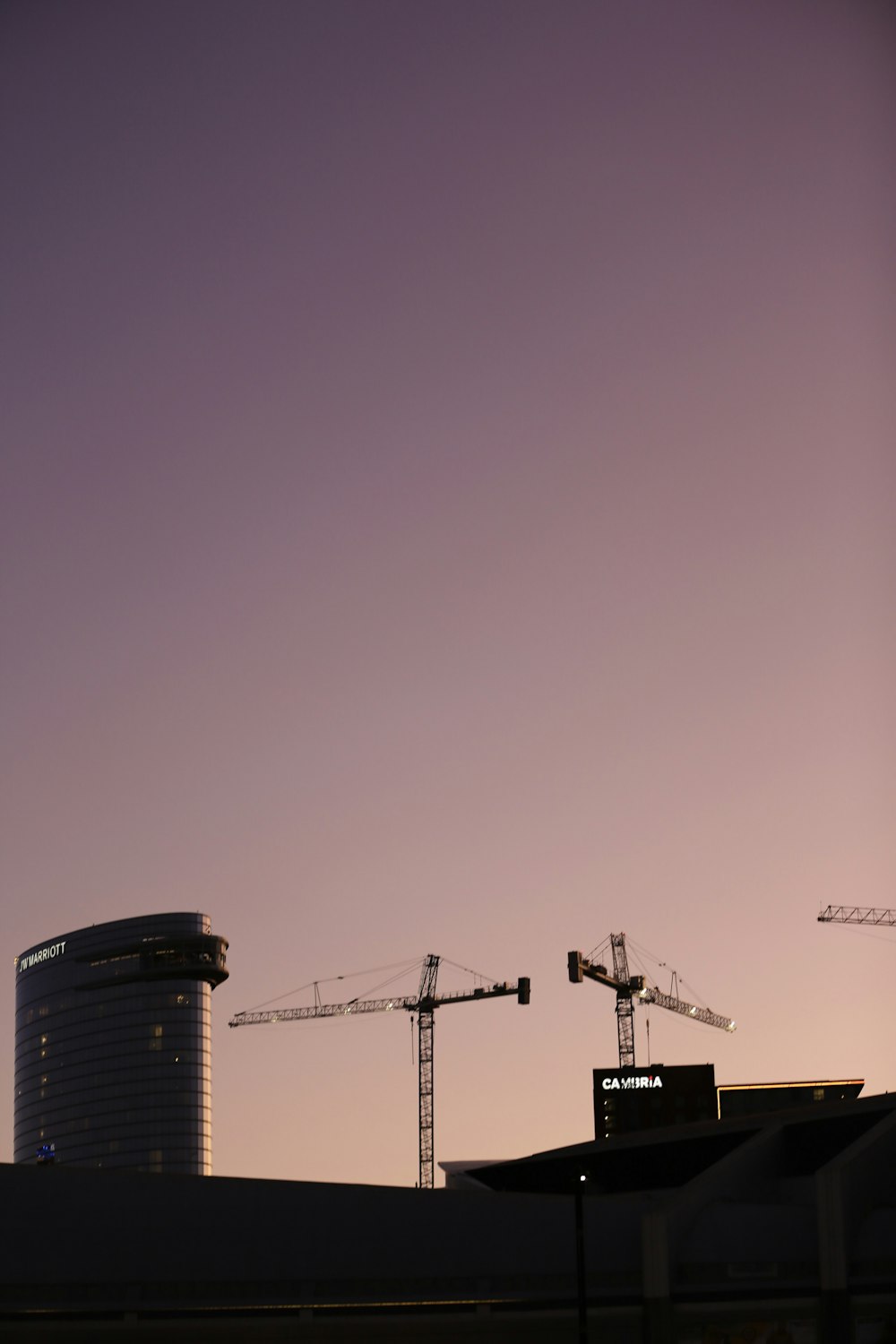 grey cranes during nighttime