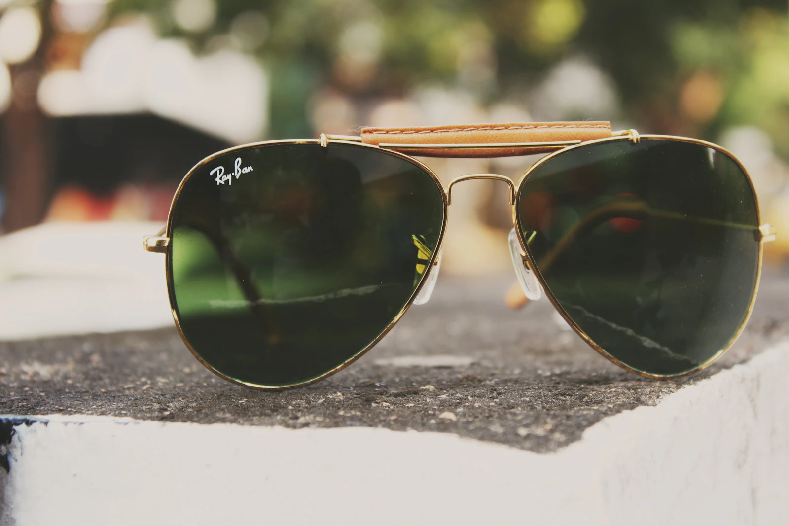 Gold Ray-Ban Aviator sunglasses close-up