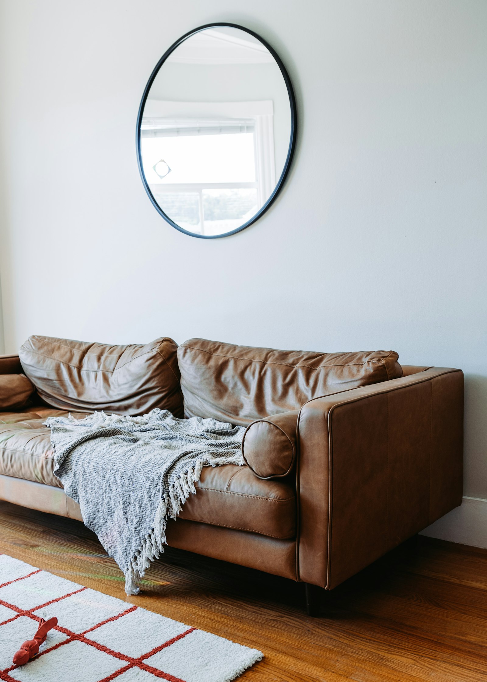 Sony a7 III + Canon 18-35mm F1.8 DC HSM | Art 013 sample photo. Brown leather sofa photography