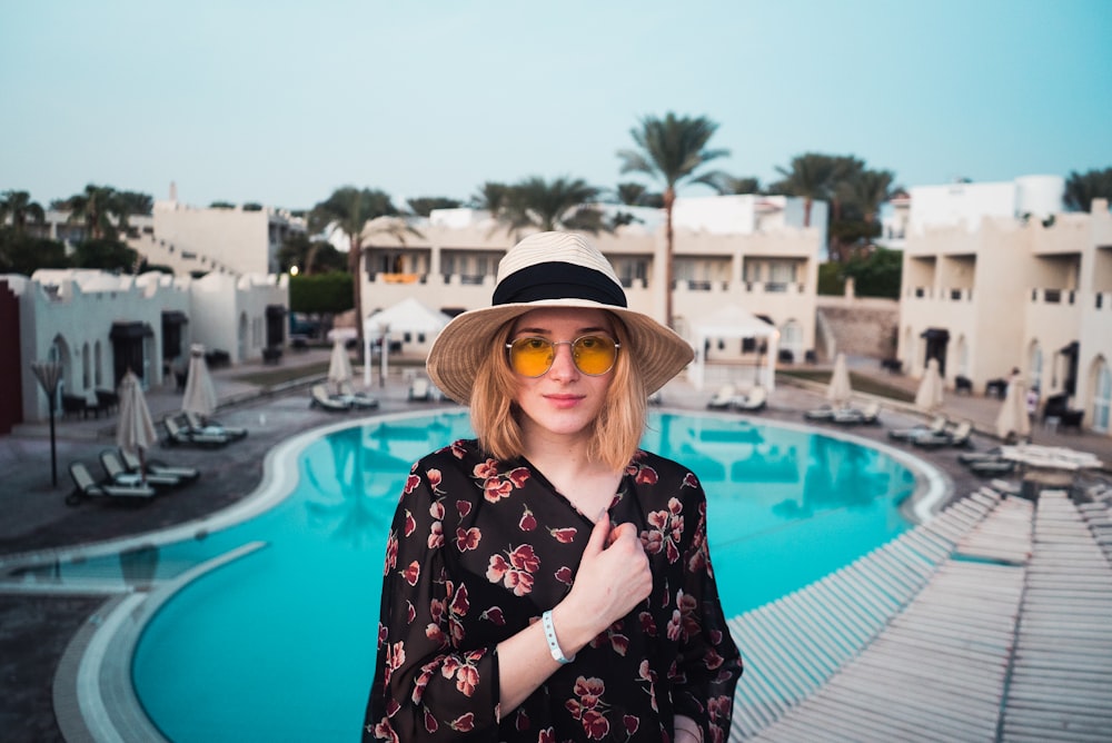 woman standing near pool