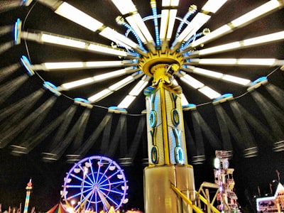 low-angle photography of turned-on swing ride rosa parks google meet background