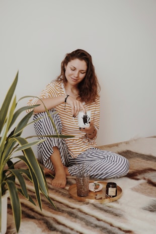 A relaxed woman in trendy, comfortable sleepwear enjoying a peaceful moment.
