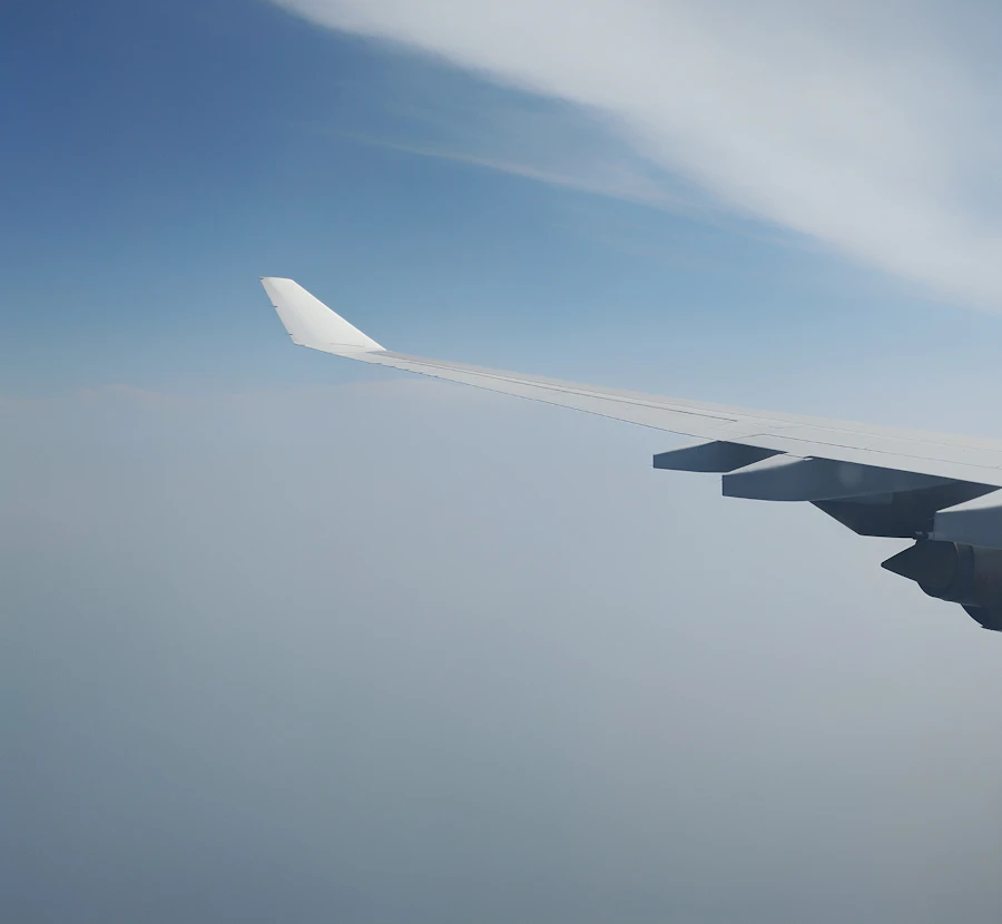 Airplane wing above the clouds