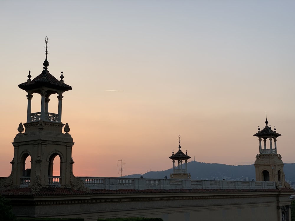 a clock tower with two bell towers on top of it