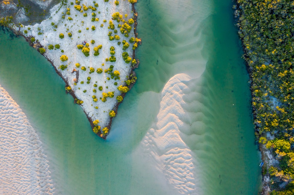 an aerial view of a river and a beach