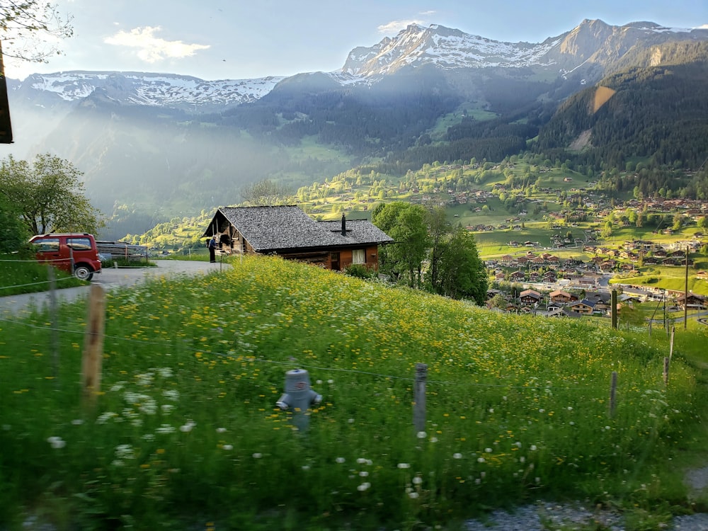 wide angle photography of building and mountain range during daytime