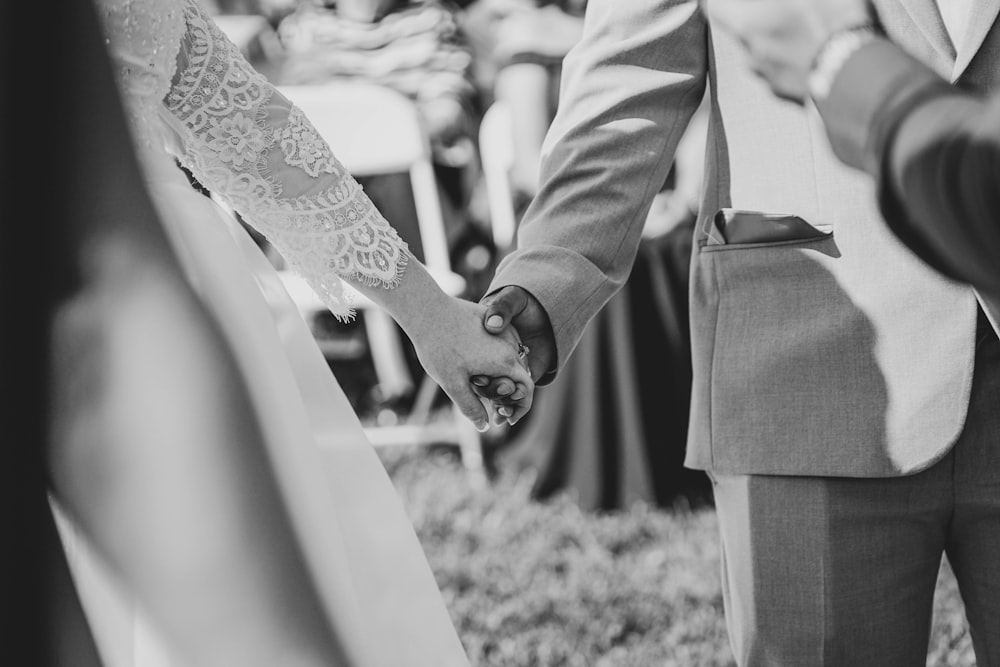 wedding couple hold each other's hand