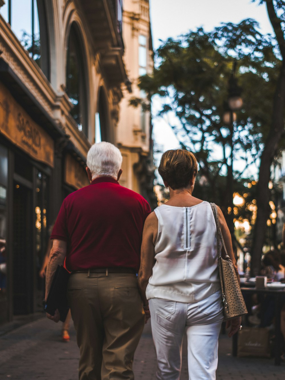 a man and a woman walking down a street