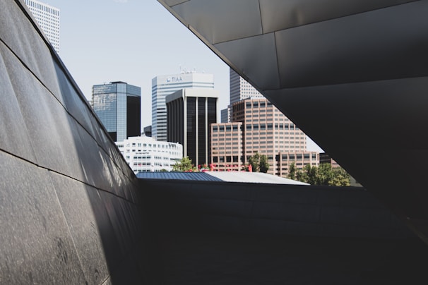 Sleek black metal frame reflecting the urban night skyline