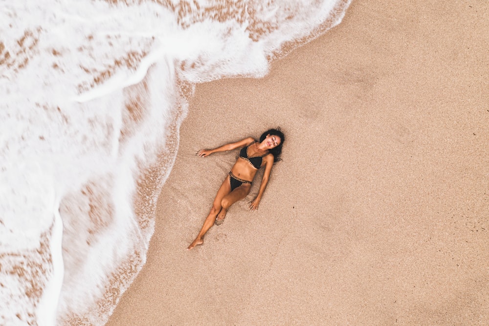 woman lying on seashore