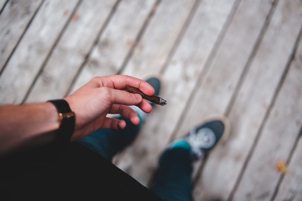 person holding cigarette