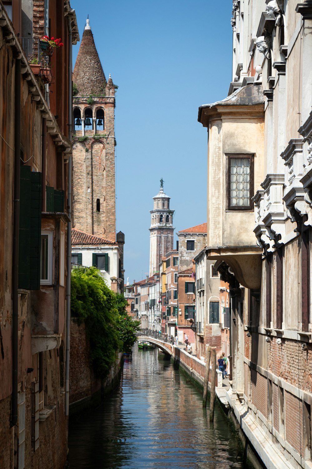 a river running through a city next to tall buildings