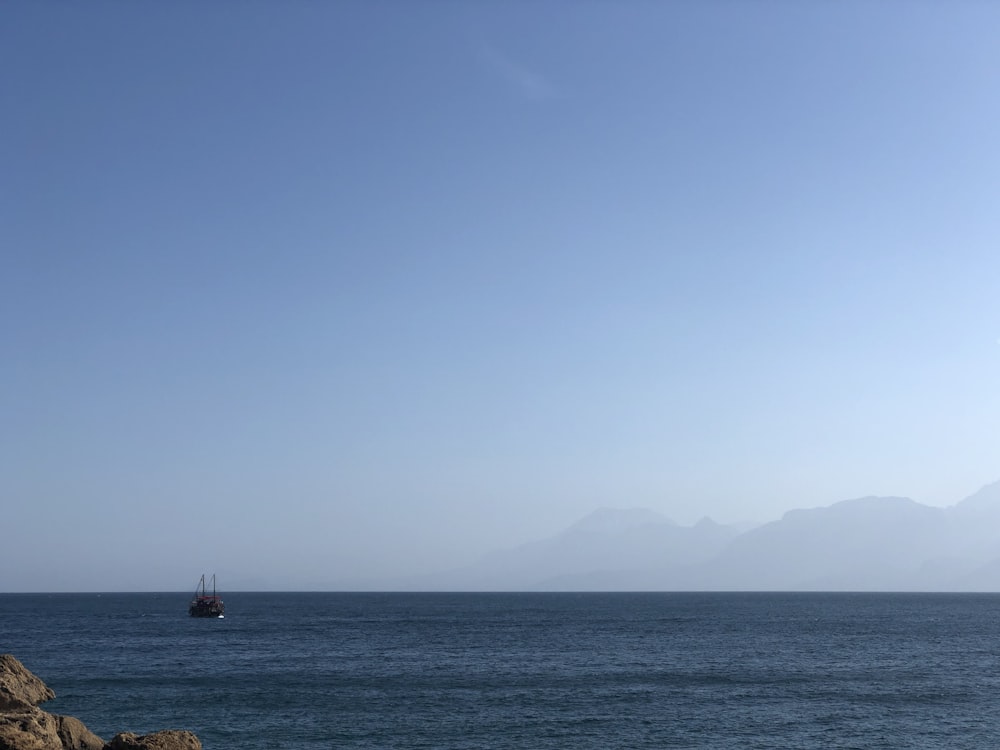 boat in ocean during daytime