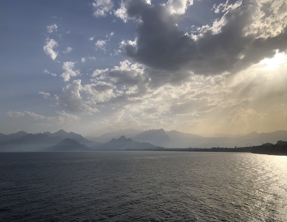 ocean under cloudy sky