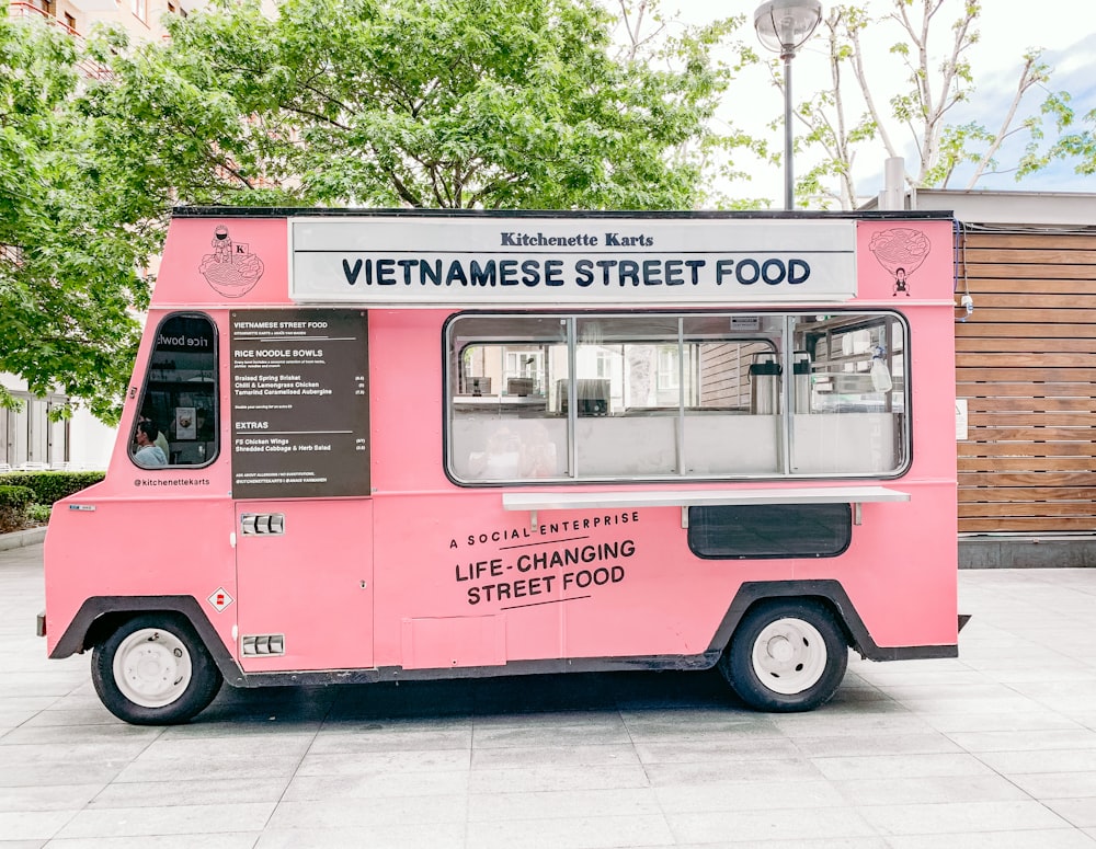 white and multicolored Vietnamese Street Food car