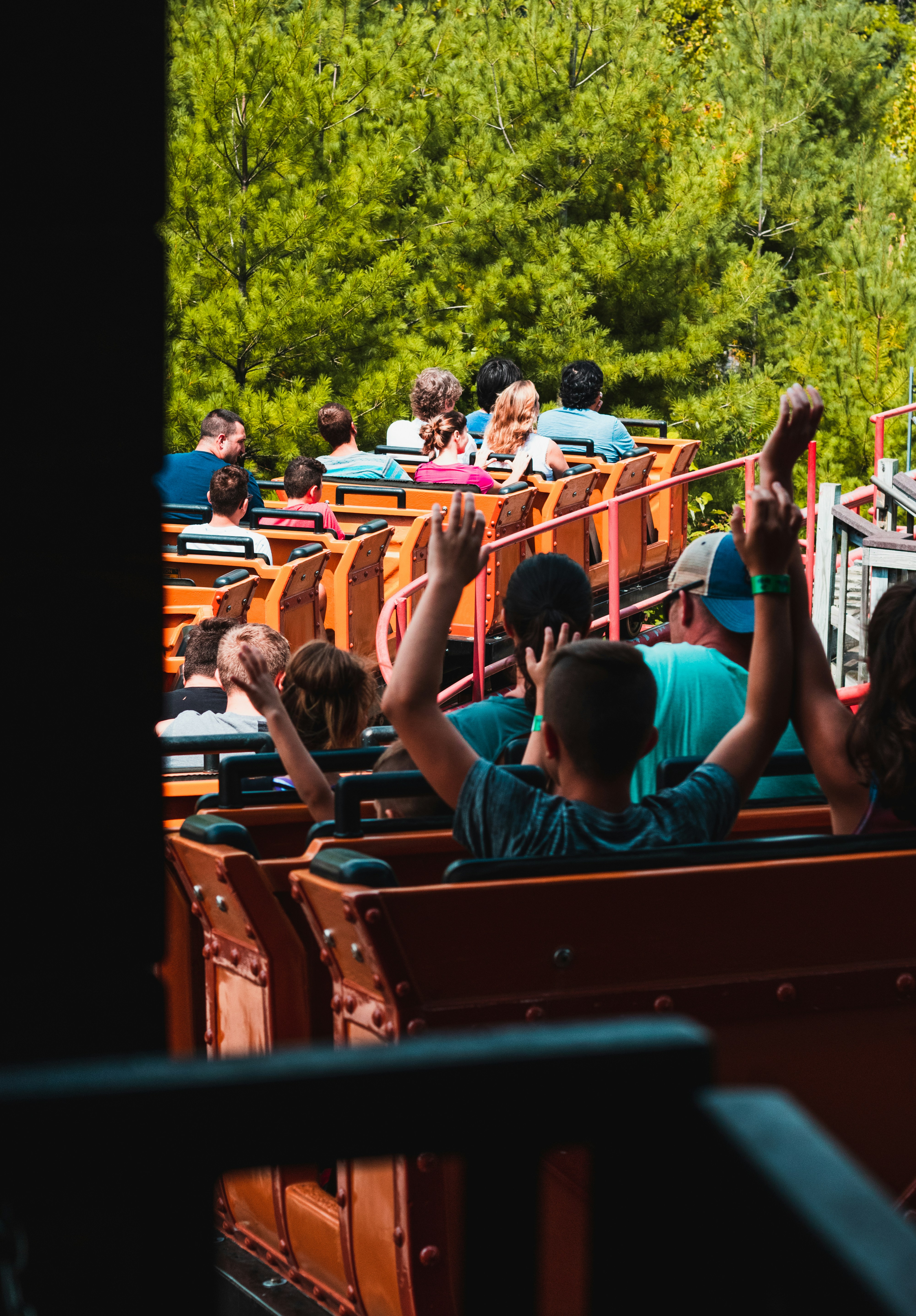 people riding on roller coaster