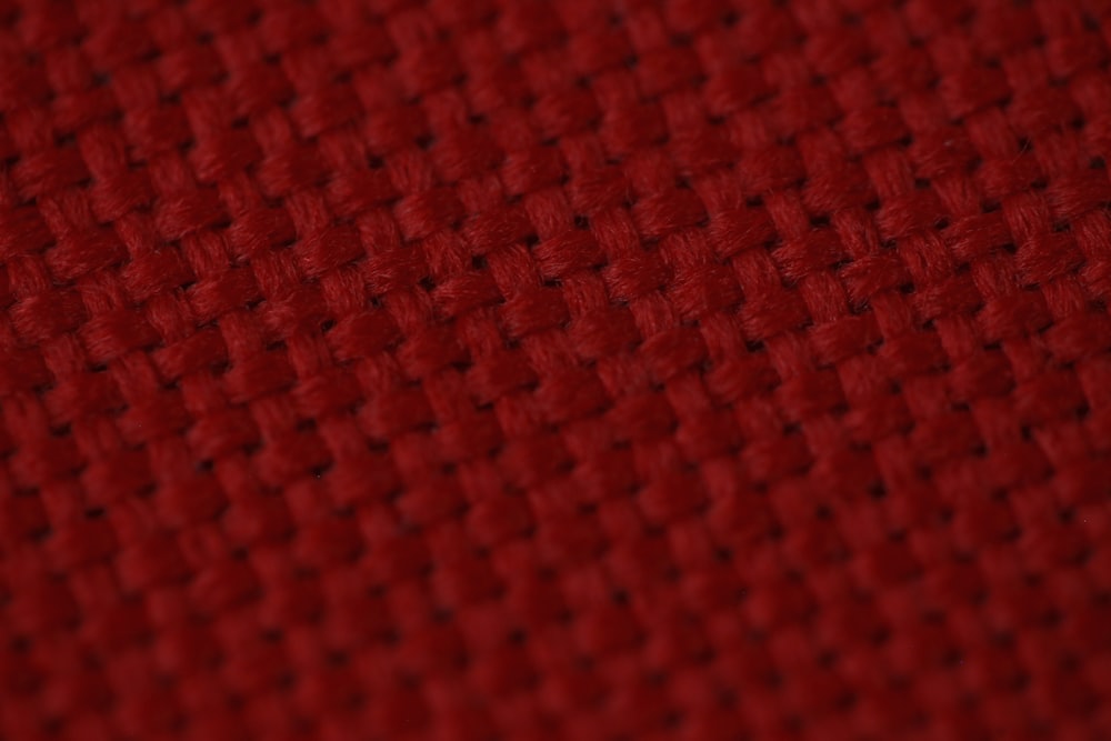 red textile in close up photography