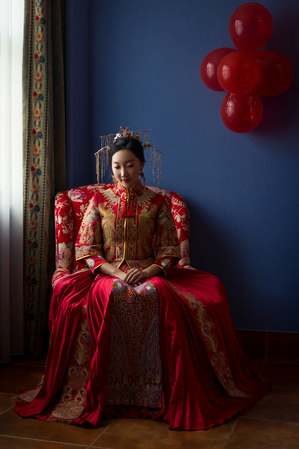 woman wears red and brown dress