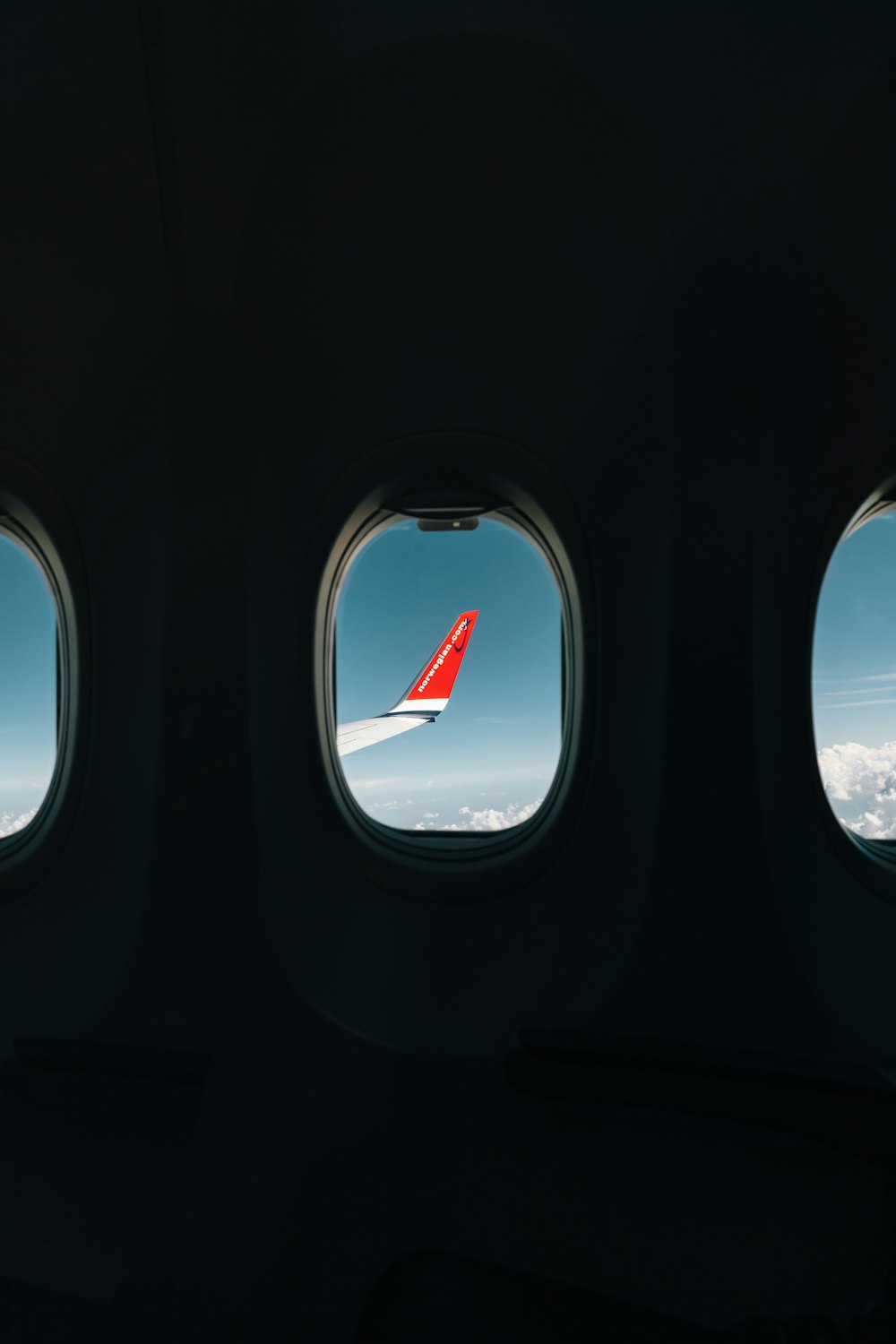 red airplane wing through window