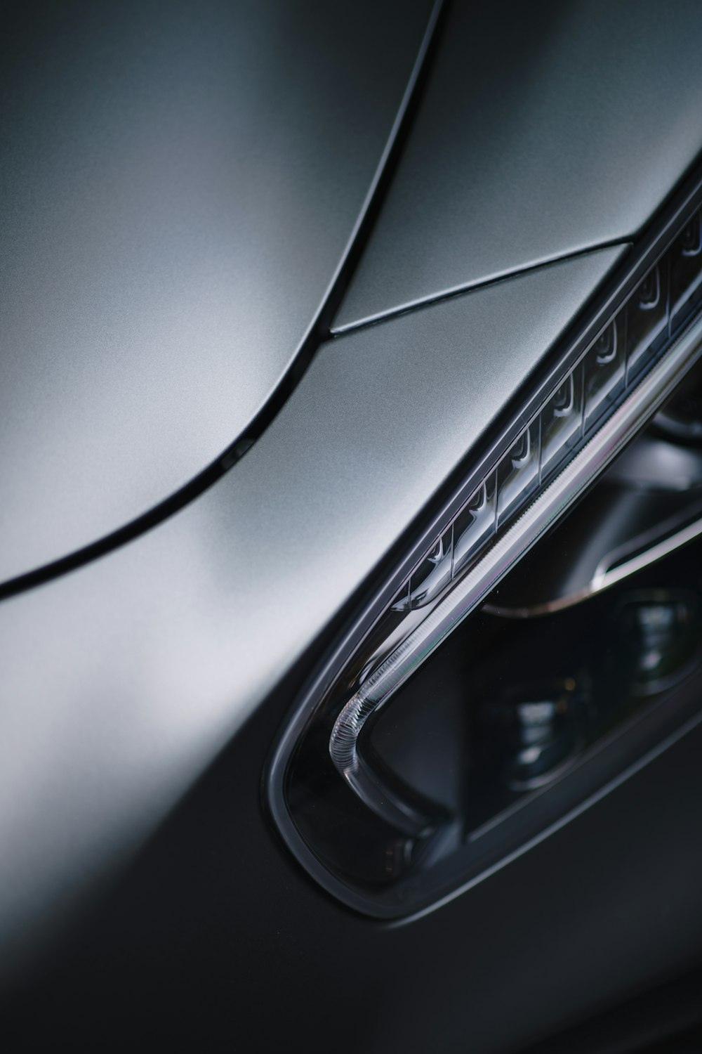 a close up of the front lights of a sports car