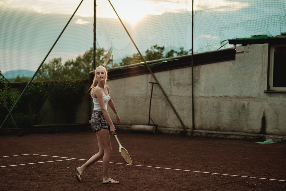 women's white tank top and grey shorts