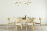 Elegant dining table set with simple, stylish chairs.