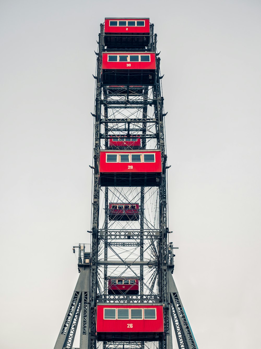 low-angle photography of red ferris wheel