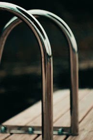 Close-up of a shiny stainless steel railing freshly polished and installed.