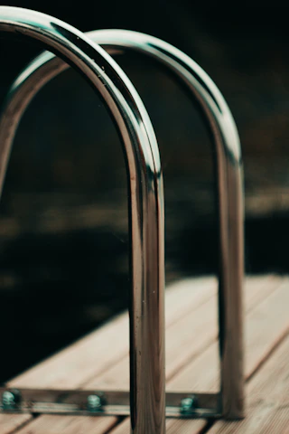 Close-up of a shiny stainless steel railing freshly polished and installed.
