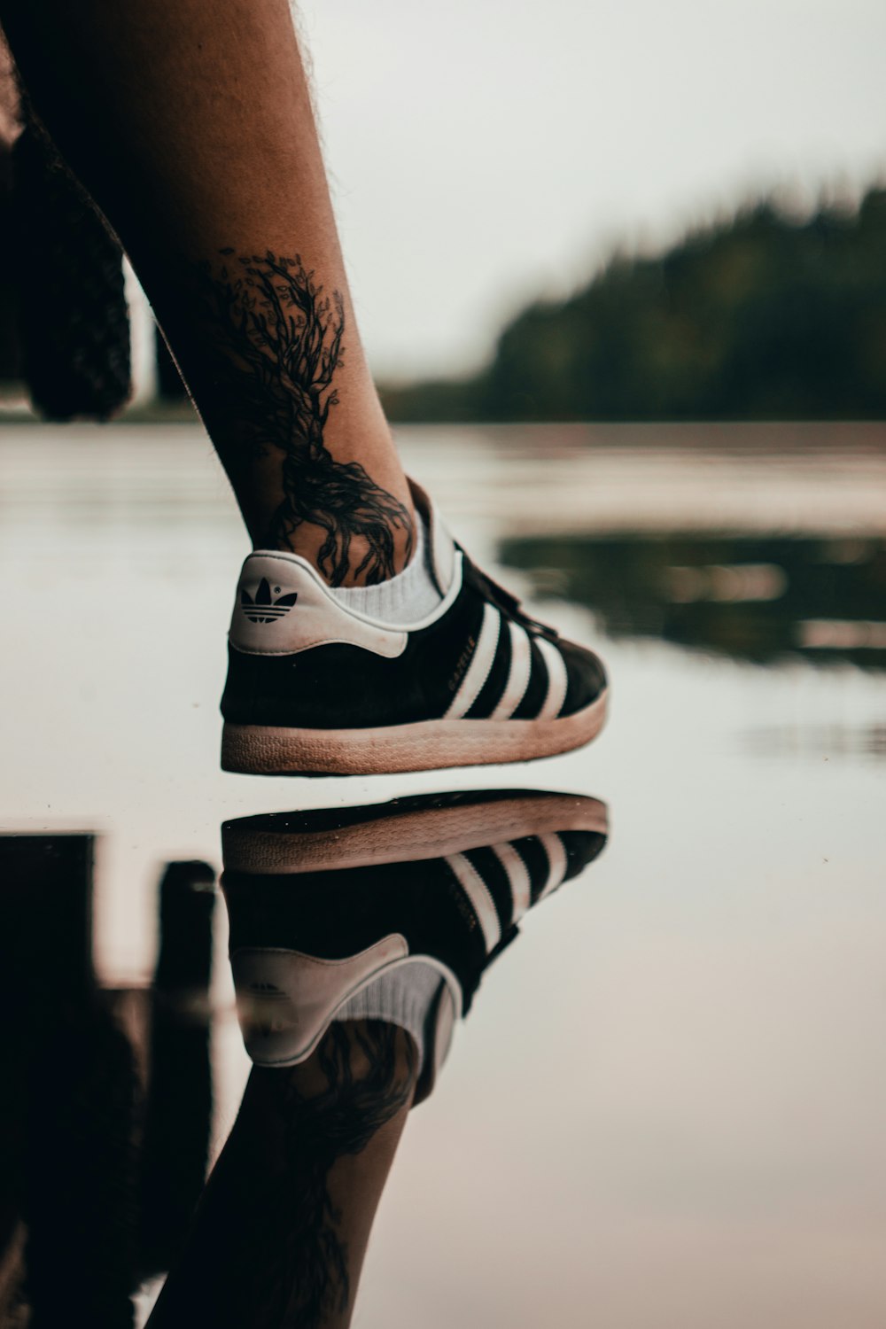 black Adidas low-top sneaker