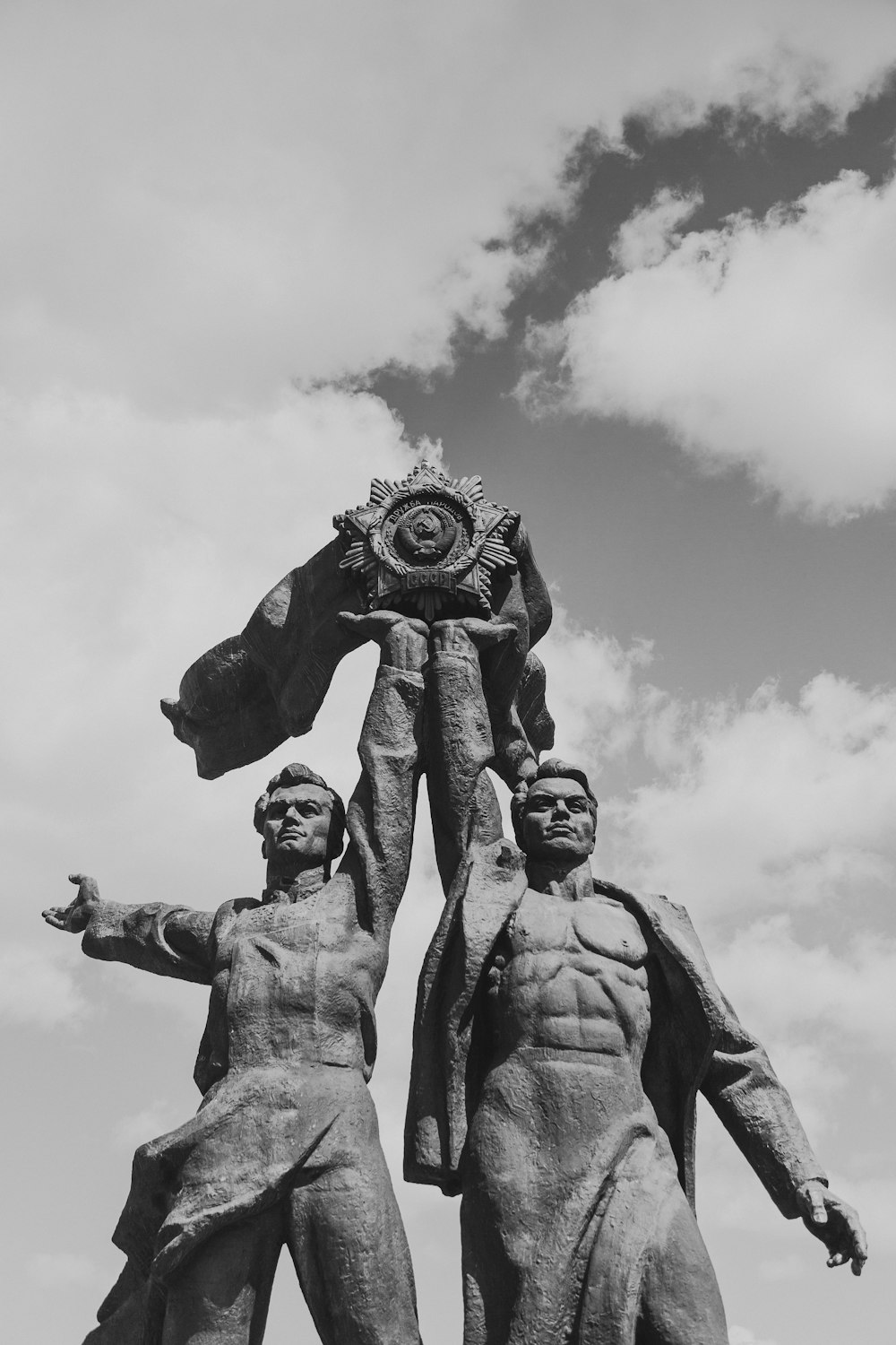 grayscale photo of two men statue