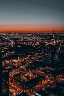 A panoramic view of Kinshasa's vibrant cityscape at dusk, highlighting its dynamic urban life.