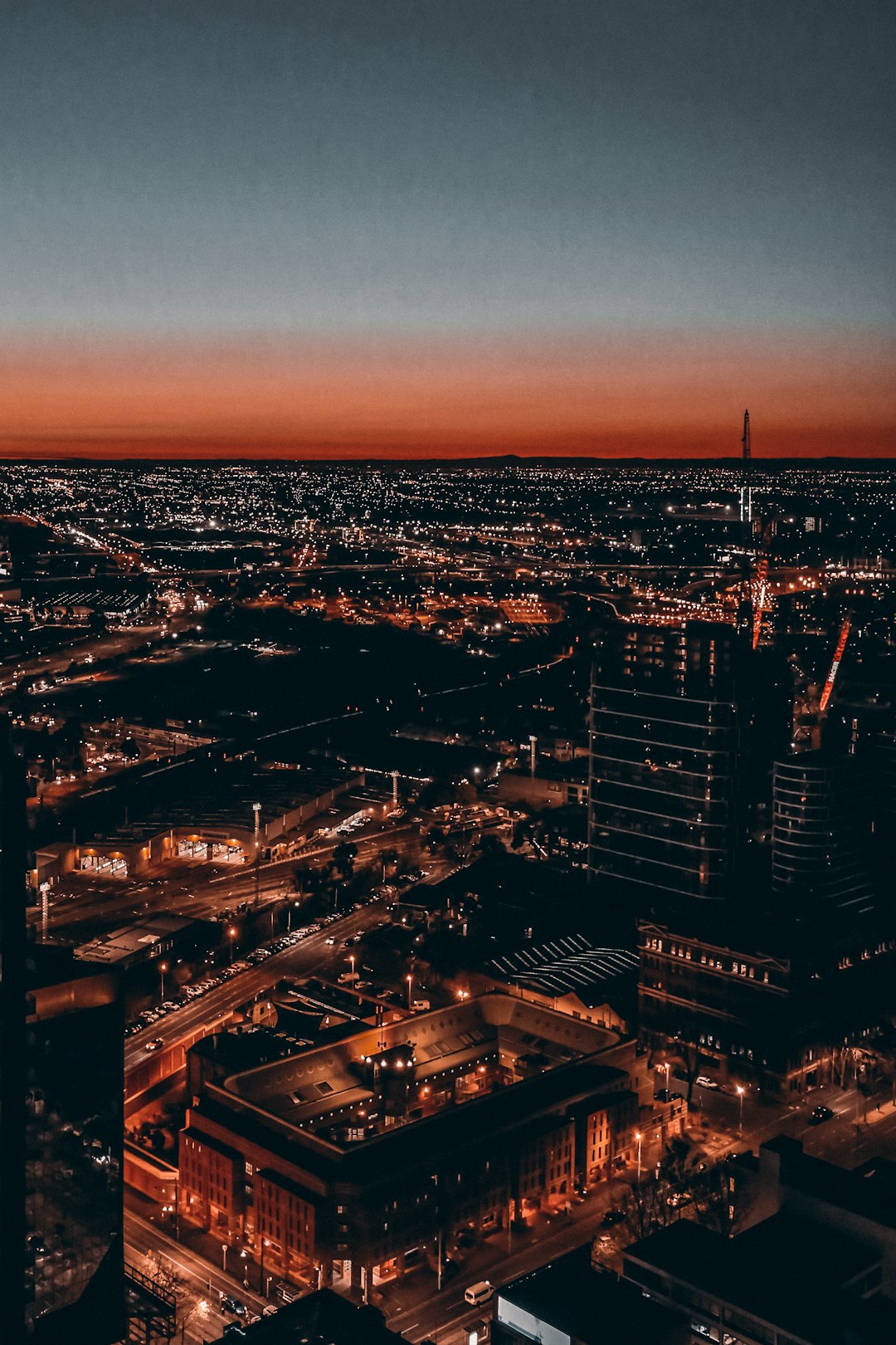 aerial photography of city with high-rise buildings during night time