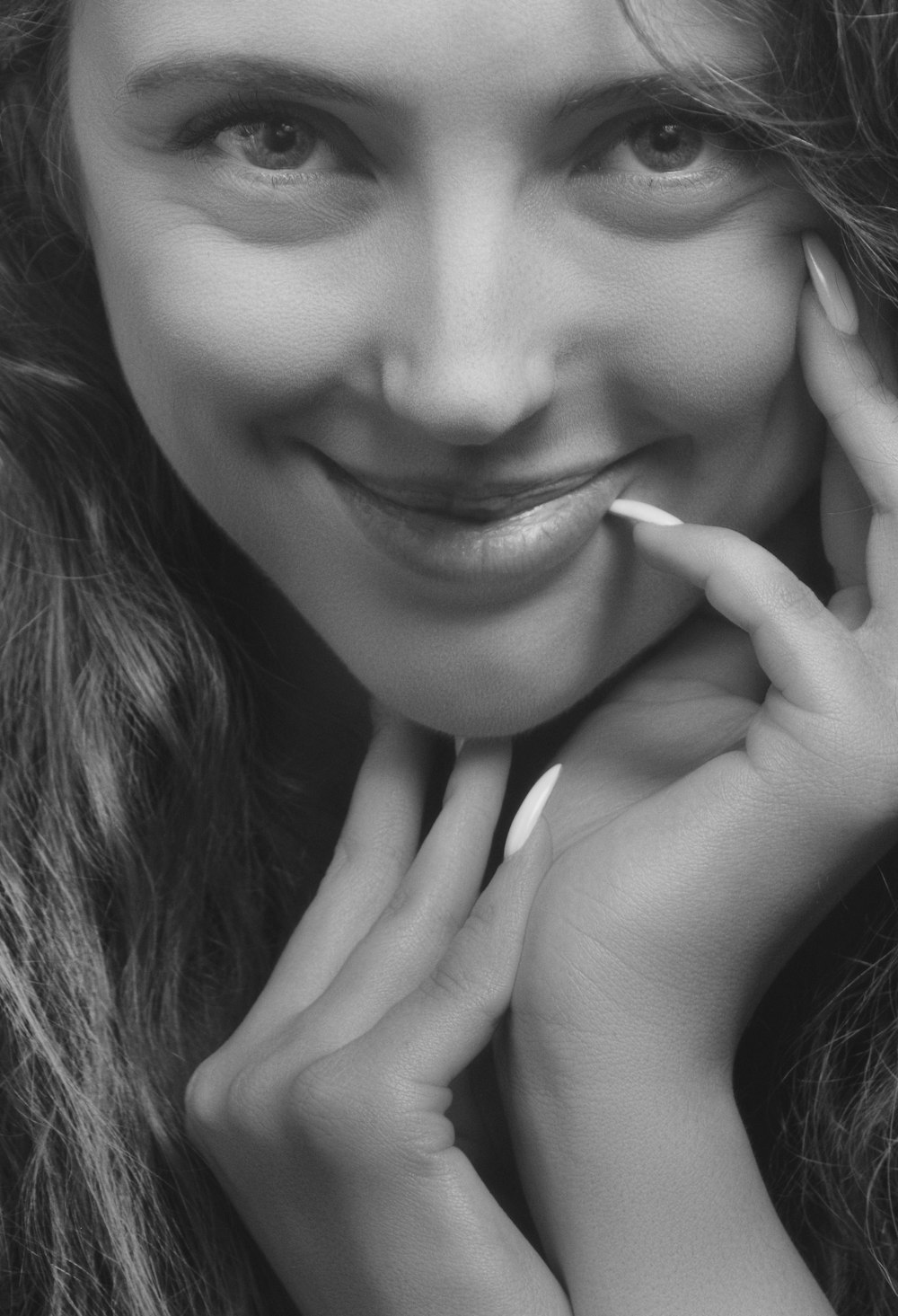 grayscale photography of woman smiling