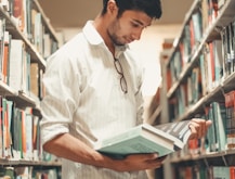 man reading in library