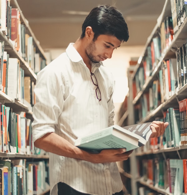 man reading in library