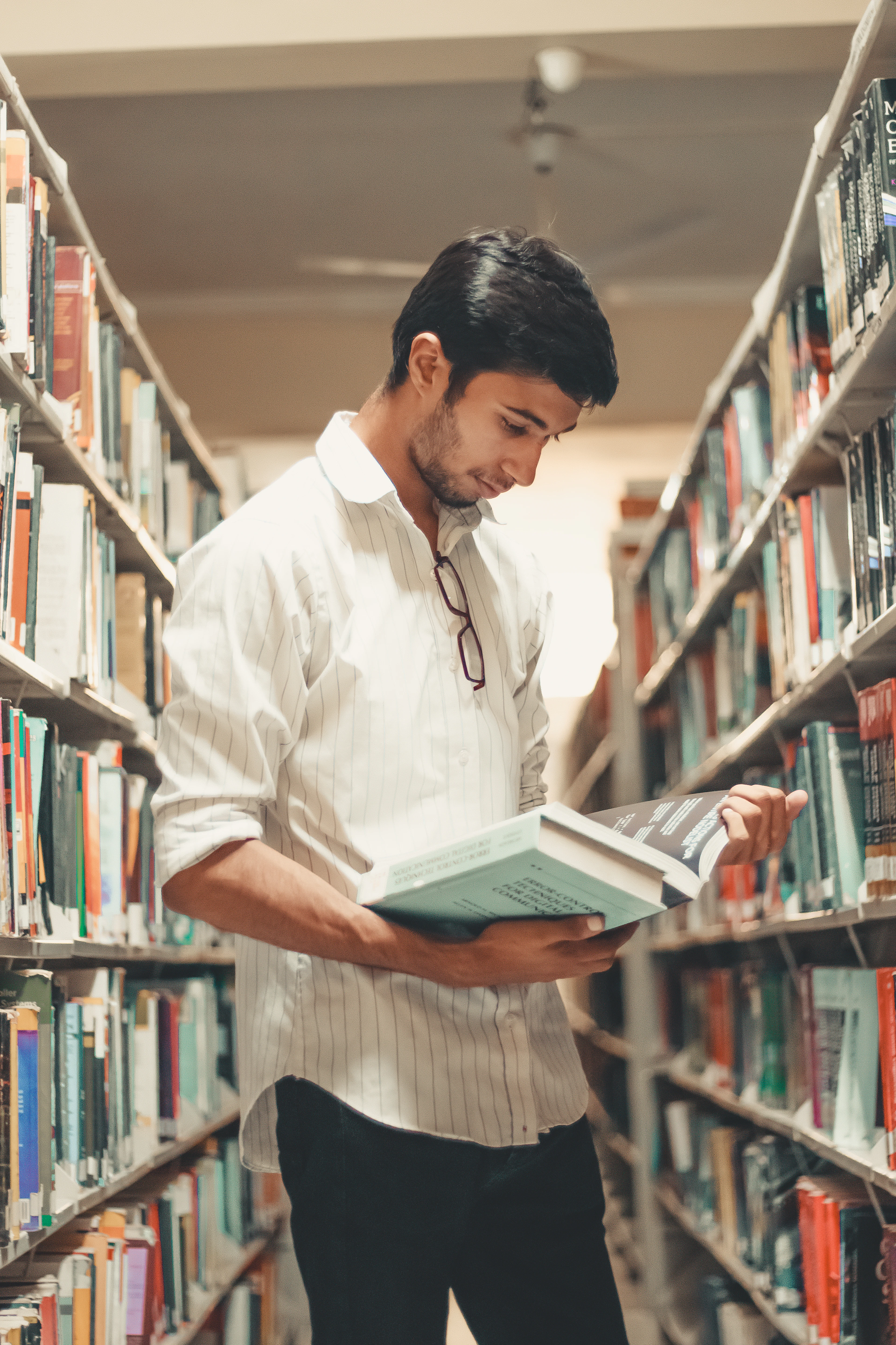 Graduate holding certification document