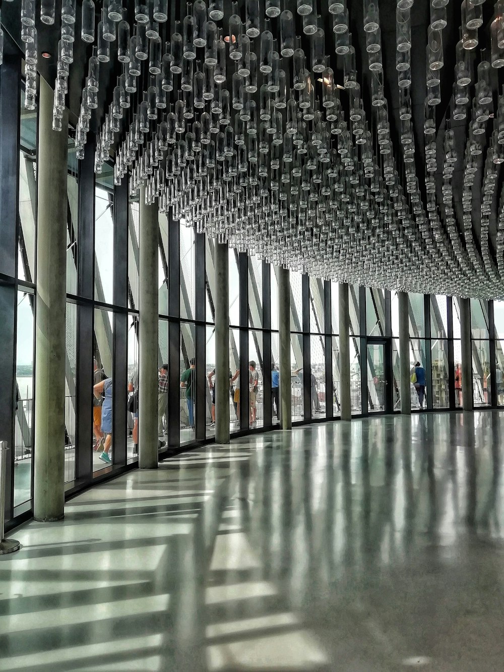 a group of people standing inside of a building