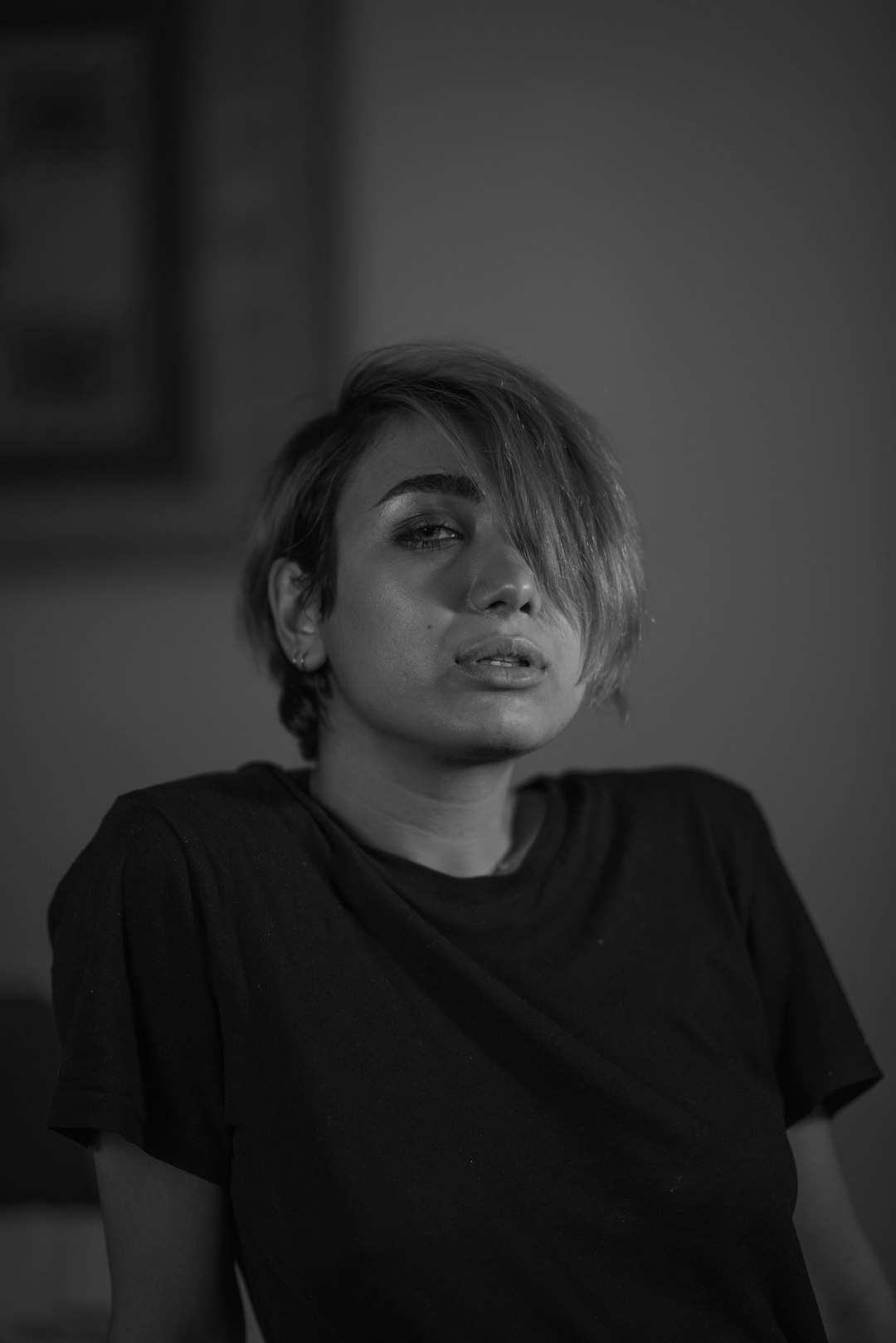 grayscale photography of woman wearing black crew-neck shirt