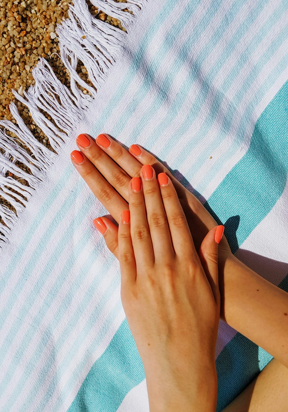 person's hands putting on towel